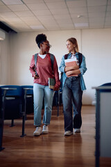 Fototapeta premium Female university friends leaving classroom after lecture.