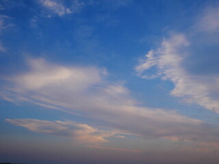 Beautiful white clouds in the blue sky at sunset