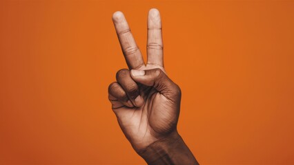 A hand making the peace sign with fingers on an orange background, AI