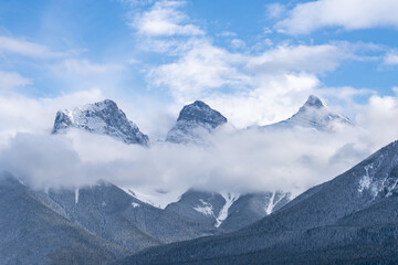 Three Sister Viewpoint, Banff National Park, Canmore Alberta Canada. Clouds surrounding the mountainscapes.