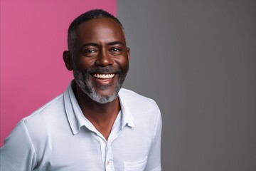 Fototapeta premium A smiling black man in a white shirt.