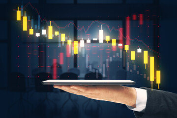 Close up of businessman hand holding cellphone with falling forex chart on dark office background. Crisis and finance concept. Double exposure.