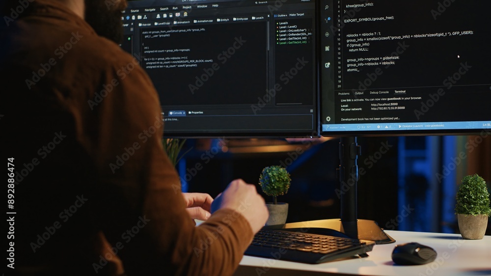 Poster software engineer typing on keyboard buttons, writing lines of code in apartment office. close up sh