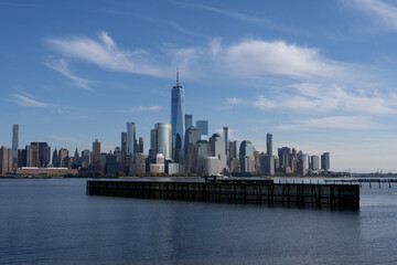 Naklejka premium New York, United States. New York city skyline in Midtown Manhattan. USA, NYC, NY, Manhattan. American big city. Lower Manhattan skyline. New York from New Jersey. Downtown Manhattan with blue sky.