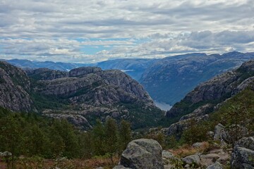 Fototapeta premium Hiking to Pulpit Rock, a location with views over the Lysefjord, involves a 4-5 hour hike with stunning views of the fjord