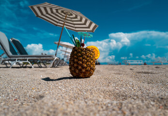 Summer vacation. Pineapple on sand beach. Summer sunny day on the beach. Beach leisure. Summertime...