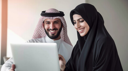 Arab couple using laptop