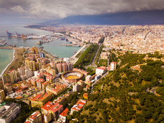 Aerial view of embankment and center of Malaga city with bullring, Spain