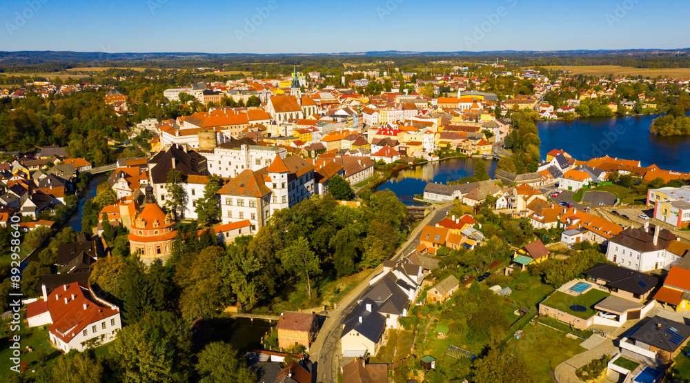 Wall mural Aerial view of old town of Jindrichuv Hradec on Nezarka river with medieval Castle on fall day, Czech Republic