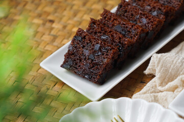 Kek Buah Kukus, a traditional Malaysian steamed fruit cake filled with dried fruits, nuts, and spices