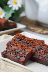 Kek Buah Kukus, a traditional Malaysian steamed fruit cake filled with dried fruits, nuts, and spices