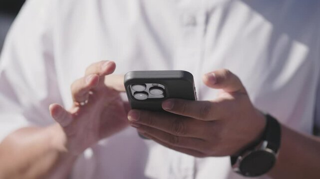 Business men hands typing message on smartphone slow motion