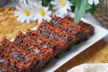 Kek Buah Kukus, a traditional Malaysian steamed fruit cake filled with dried fruits, nuts, and spices