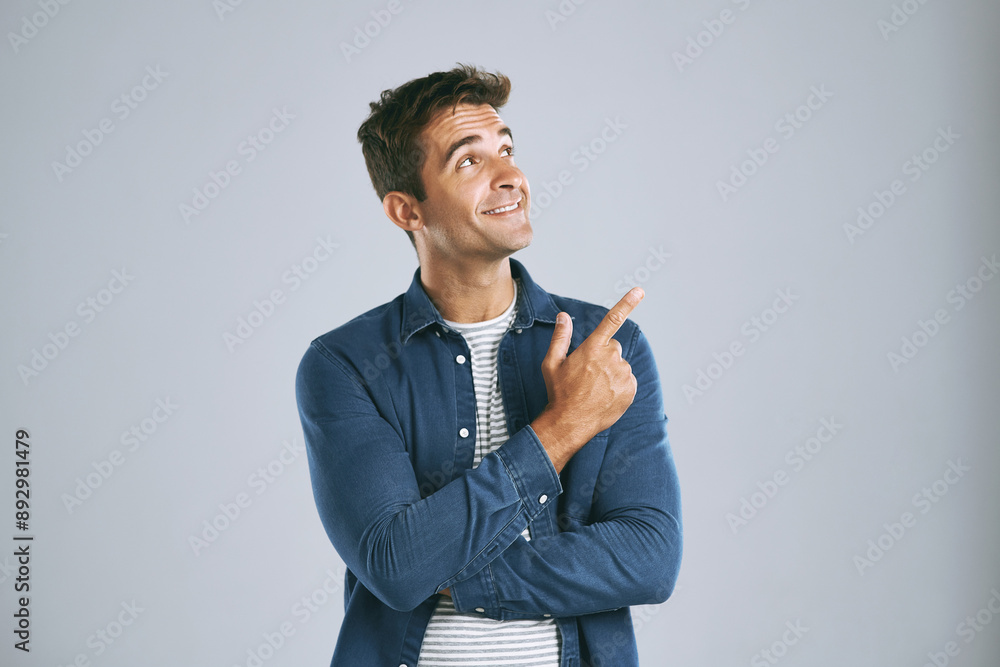 Poster man, studio and pointing at mockup for idea, opinion and choice on gray background. male designer, d