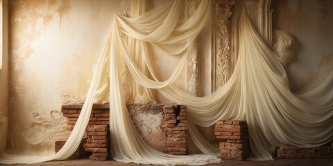 Sheer fabric drapes over a brick wall with stucco accents