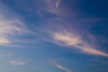 Fototapeta premium Clouds with warm light and blue sky in the afternoon