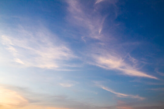 Clouds with warm light and blue sky in the afternoon