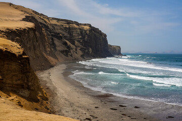 Paracas, Peru: Dramatic view of the rugged coastline of Paracas Peninsua along the Pacific Ocean in Peru in south America