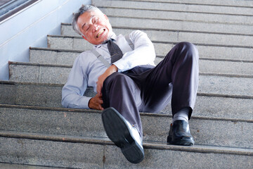 A man falls down the stairs and is injured.