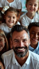 Obraz premium Teacher and his primary school class celebrating coming back to school. Male educator and a group of children smile at the camera while standing in a classroom. School class feeling excited to start 
