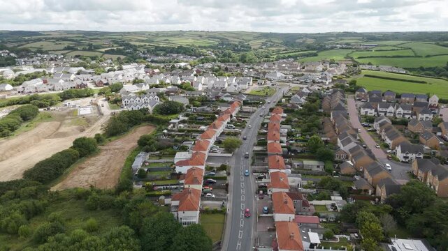 Aerial view of Stratton in Bude, Cornwall, capturing the extensive layout of residential homes, community areas, and the surrounding countryside