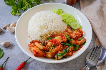 Rice topped with stir fried Thai basil with crispy pork , pad ka praow moo krop ,Thai food, top view food table