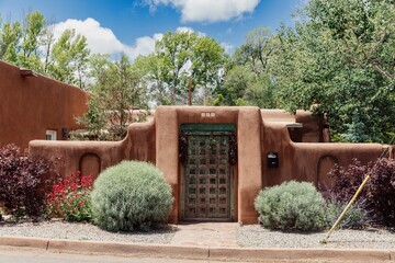 Fototapeta premium Fence of a Pueblo style house in Santa Fe, New Mexico, United States Of America.