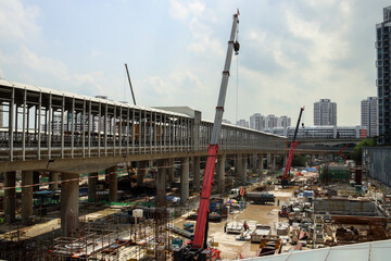 Naklejka premium Cranes On Construction Site On Summer Day