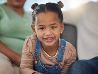 Girl, child and portrait with smile in home for relax, confidence and innocent in living room. Kid,...