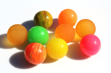 Collection of colorful rubber balls on a plain white background