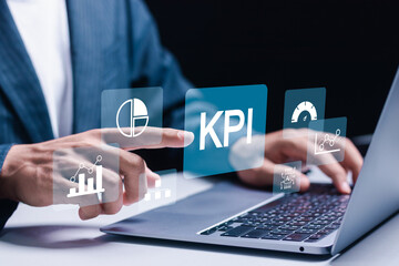 KPI, business performance indicators, Businessman working with data management system on virtual screen to make report with KPI, metrics connected to database. finance, operations, sales, marketing.