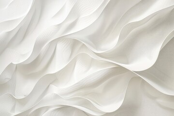Obraz premium Soft, flowing white fabric drapes in gentle waves, creating an ethereal and elegant texture