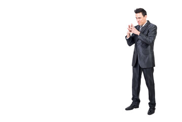 Scheming businessman looking at camera in studio