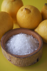 Coarse salt and lemon on table 