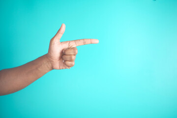 Hand Gesturing Finger Pointing on Blue Background with Minimalist Style and Symbolic Communication