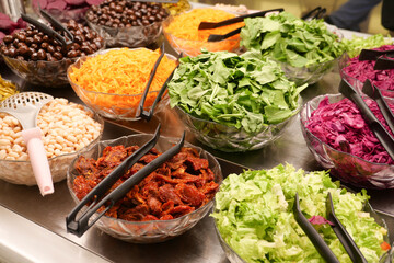 The salad bar offers fresh vegetables and tasty toppings for a diverse and wholesome meal