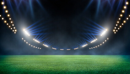 Green soccer field, bright spotlights,	
