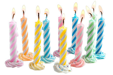 Colorful birthday candles with stripes lit in a row, perfect for celebration and party decorations, casting a warm, festive glow.