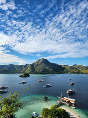 Blue skies above Kelor Island, where mountains stand as silent sentinels of timeless beauty.