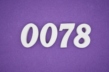 The numbers are made of white paint wood, placed on the background as a purple paper.