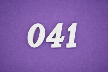 The numbers are made of white paint wood, placed on the background as a purple paper.