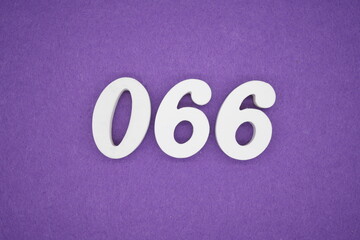 The numbers are made of white paint wood, placed on the background as a purple paper.