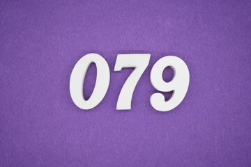 The numbers are made of white paint wood, placed on the background as a purple paper.