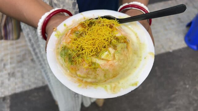 Raj Kachori - popular Indian chaat which crispy fried shells (kachori) filled with potatoes, boiled moong dal, yogurts, spices.