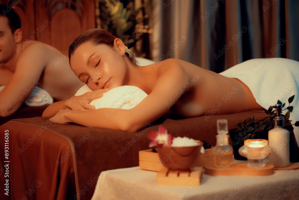 Wall mural caucasian couple customer enjoying relaxing anti-stress spa massage and pampering with beauty skin r