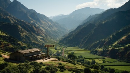 A beautiful landscape image of a mountain range in the distance with a large tree in the foreground and a small house to the left.  
