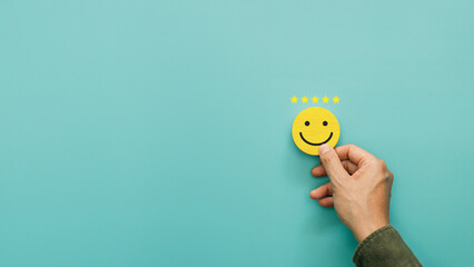 Service rating, satisfaction and positive feedback concept. Customer show smile face emoticon for...