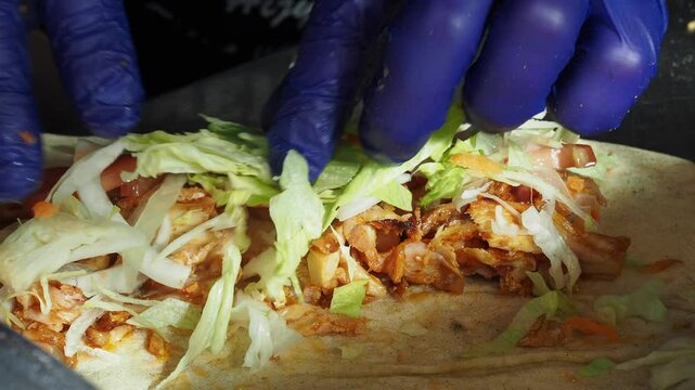 preparing doner chicken wrap at instanbul street 