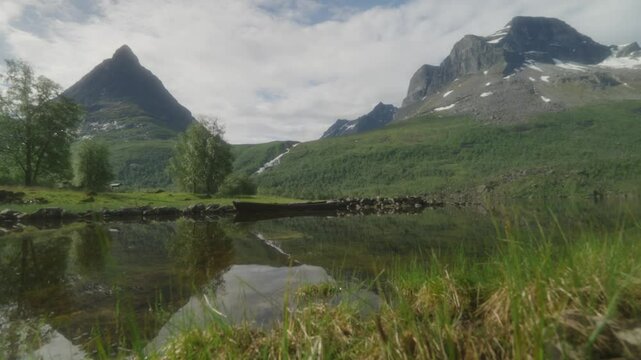 Stunning Innerdalen valley with serene lake and majestic mountains in Norway