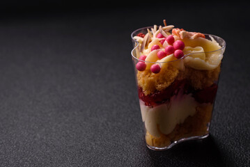 Delicious nutritious vegan dessert trifle with berries, cheese cream